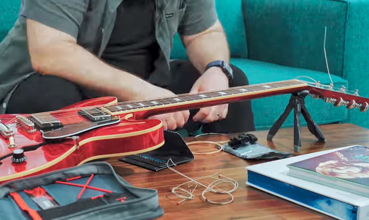 What happens when you put acoustic strings on an electric guitar